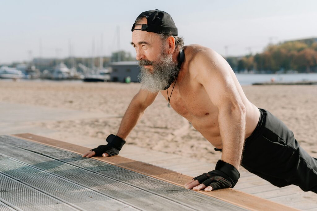 Fit older man's exercise routine outdoors, representing endurance, longevity, and cellular vitality.